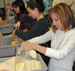 volunteers packaging food