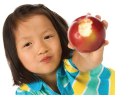 girl holding apple