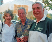 Board chair Bob Cross (center) visits with former Governor and Mrs. Mike Lowry.