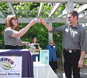 Community Relations Manager Diana Crane and PCC 2004 Cooperator of the Year recipient Mark Huppert.