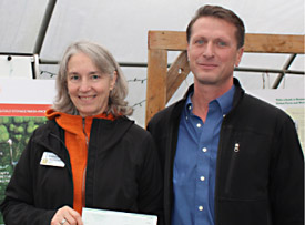 Andrea accepting check from Scott