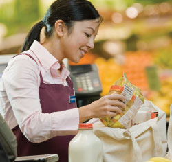 woman bagging groceries