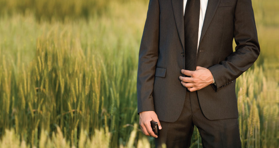 Person wearing a suit in field