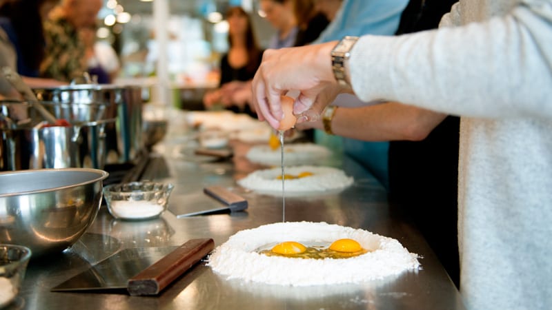 cracking an egg into bowl