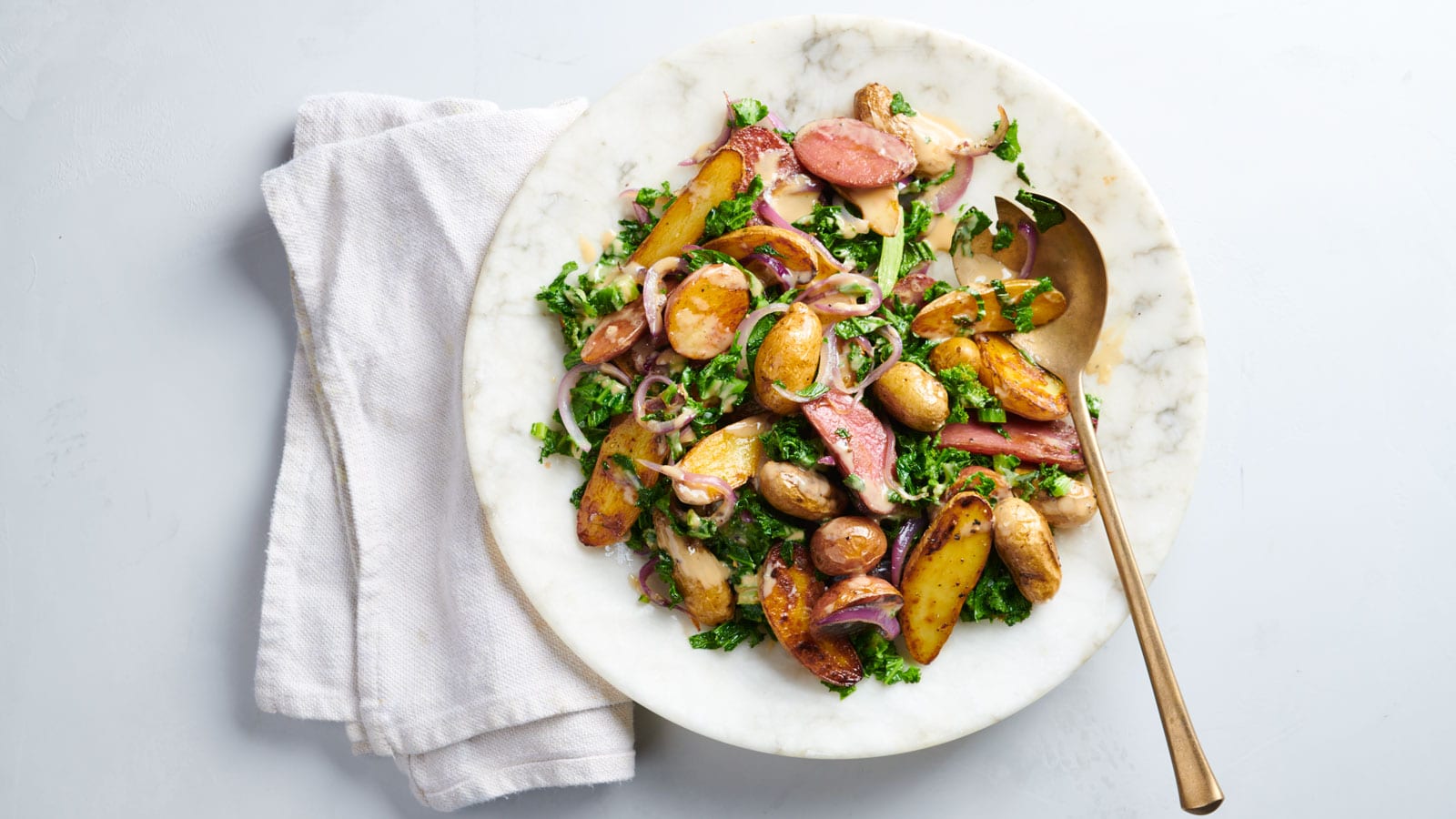 Roasted Fingerling Potato Salad with Mustard Greens and Tahini Dressing