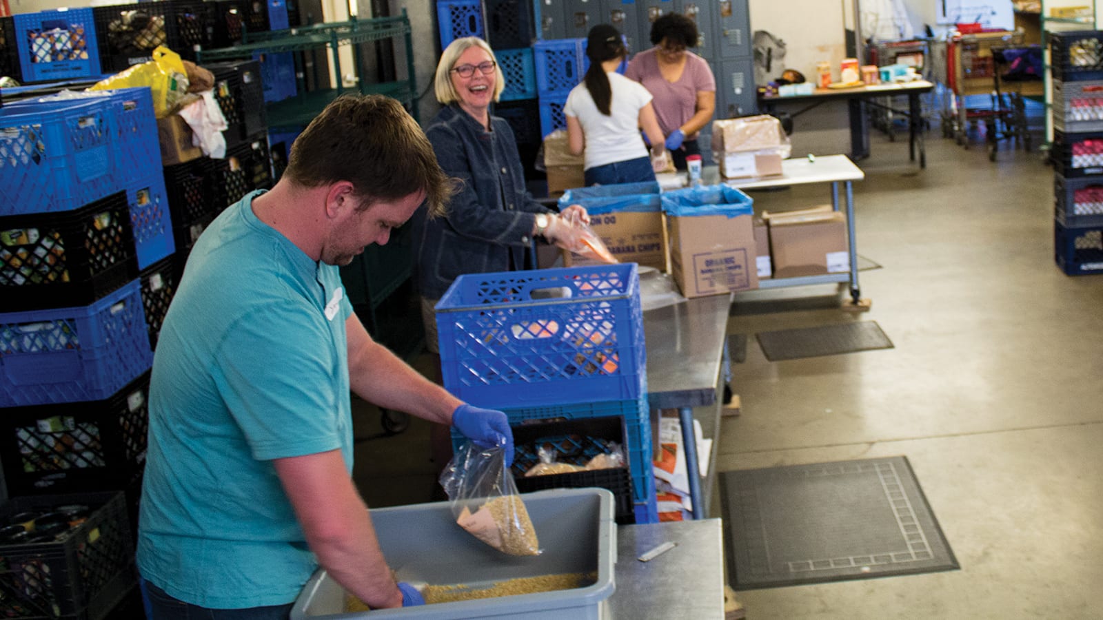 happy volunteers helping at food bank