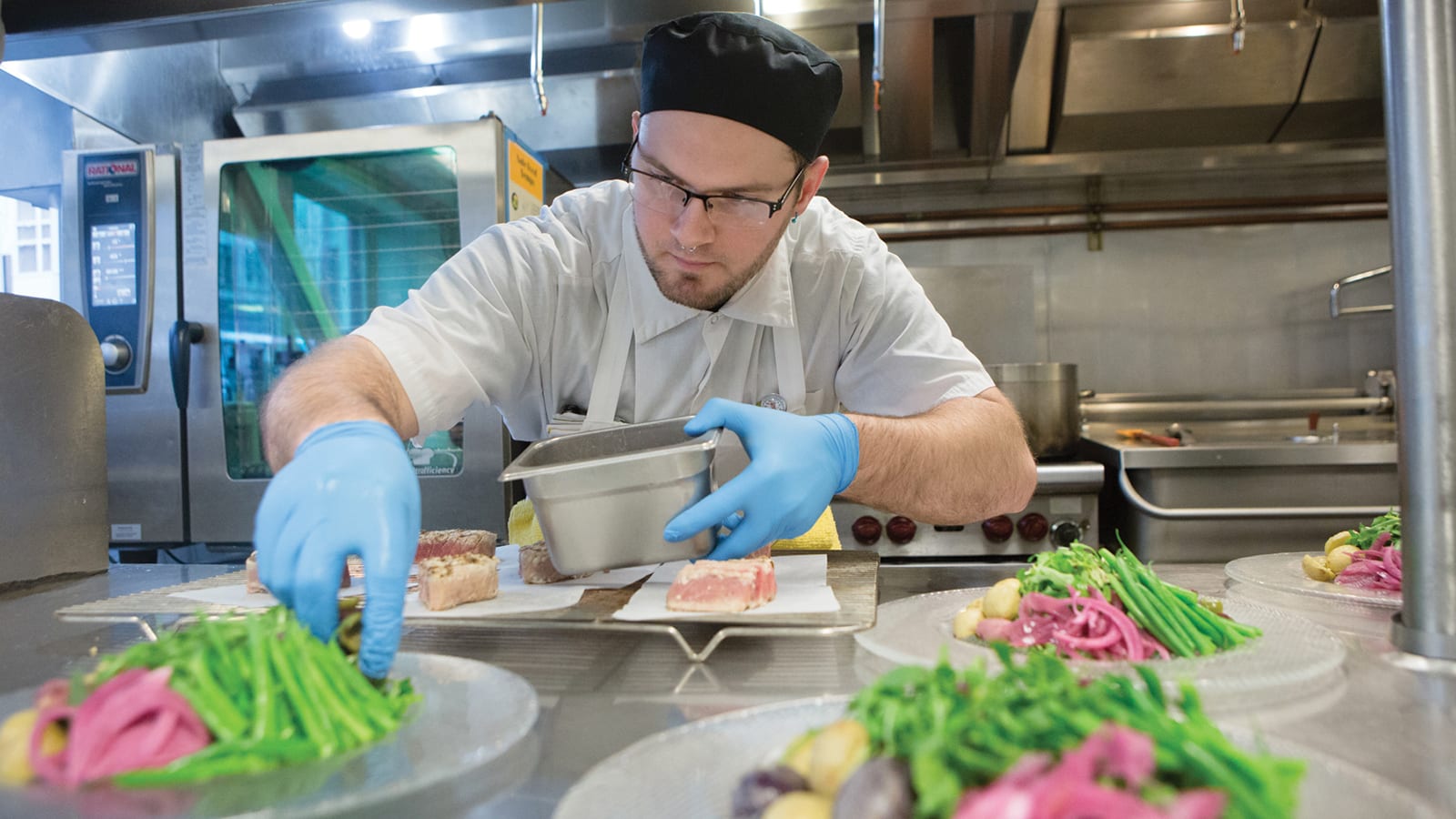 A FareStart Adult Culinary Program student training in the FareStart Restaurant.