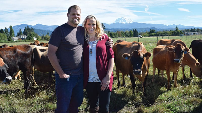 Dairy farmers Ryan and Haylee Mensonides/photo by Molly Goren, courtesy of PCC Farmland Trust.