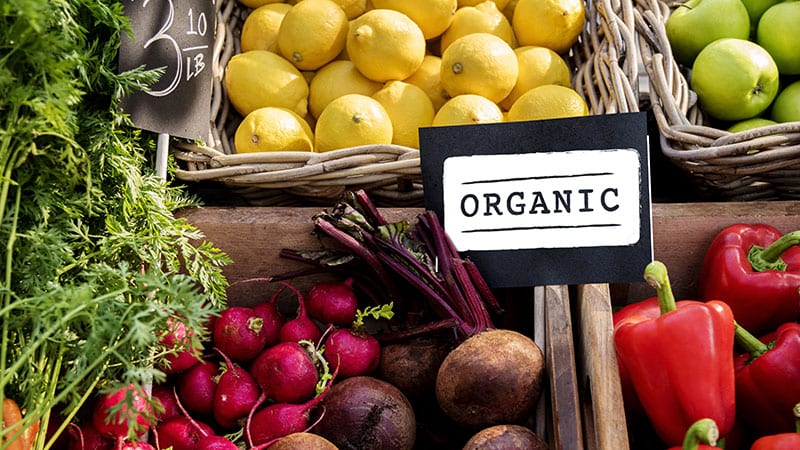 Organic produce stand at a market.